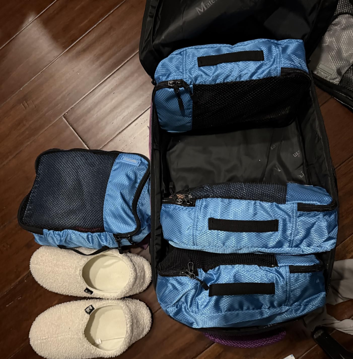Amazon Essentials 4-Piece Packing Cubes Travel Accessories Set, Space-Saving Luggage Organizers with Double Zipper, Mesh Top, Small/Medium/Large/Slim, Blue (Previously Amazon Basics) customer photo 2