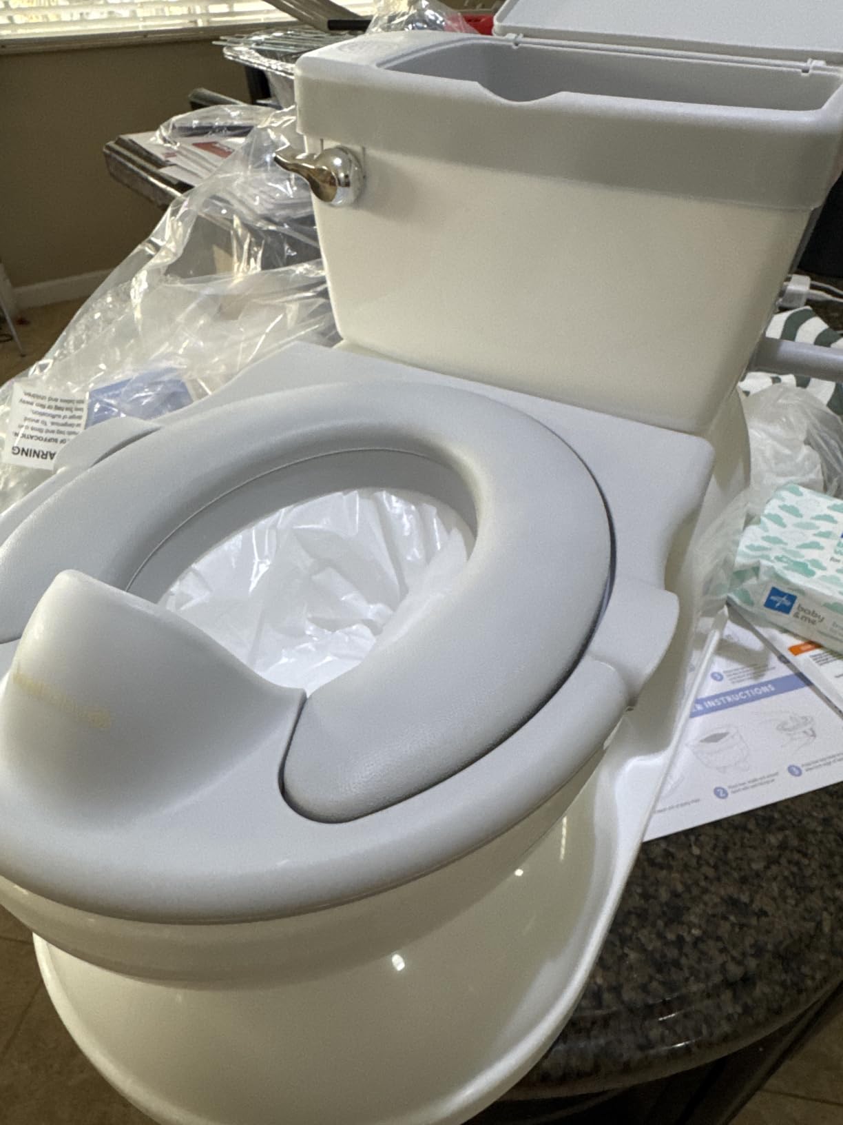 Jool Baby Real Feel 2-in-1 Potty with Wipes Storage, Flushing Sounds & Disposable Liners - Realistic Toilet - Easy to Clean & Assemble (Gray) customer photo 1