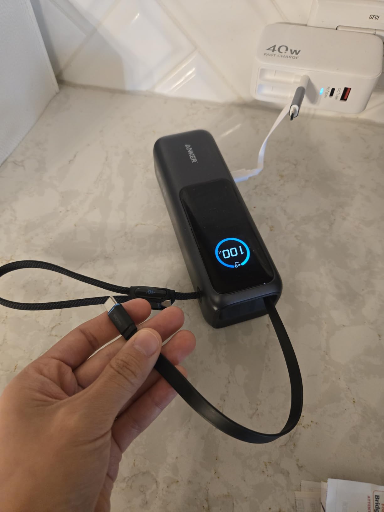 Anker Laptop Power Bank, 25,000mAh Travel Essential with 165W Total Output | 3 USB-C Ports with 100W Max Each, Built-In Retractable Cables, Flight-Ready, for iPhone 17 Series ,MacBook, and More customer photo 1
